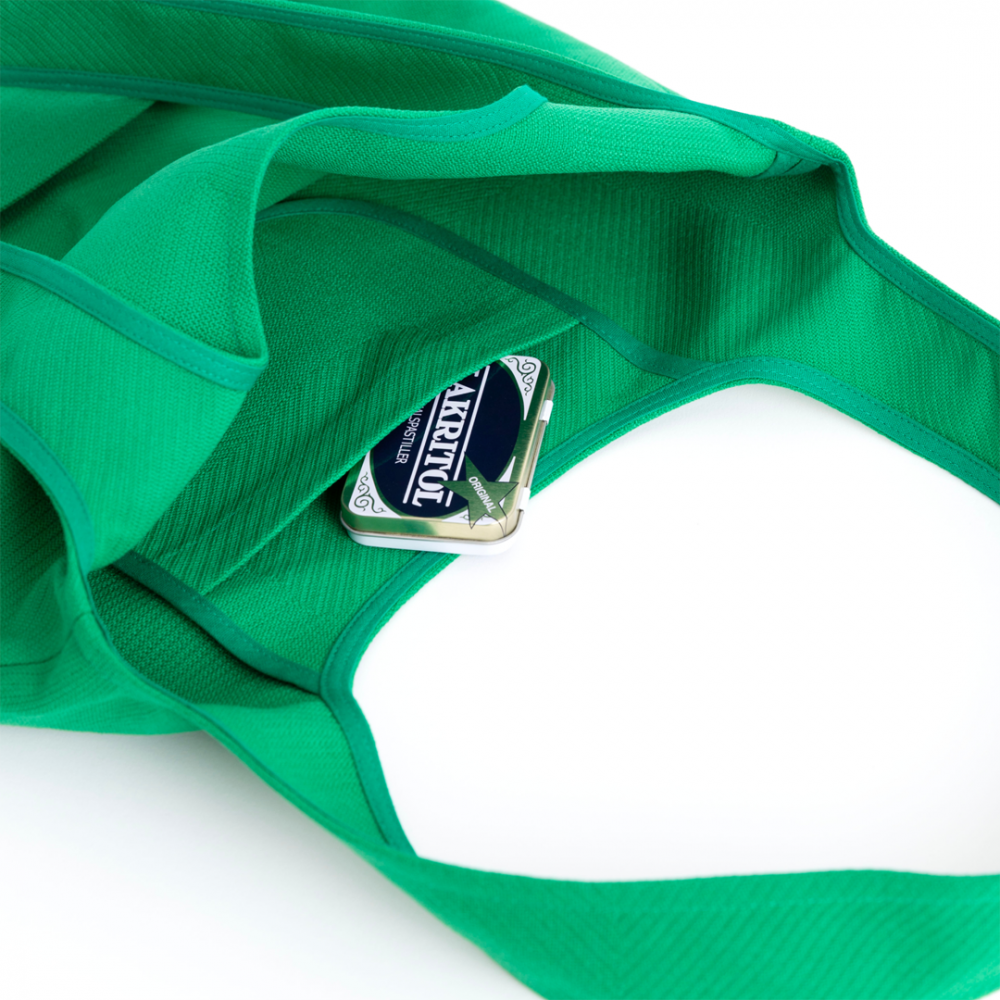 Close up of the Troppo Famiglia Bag in Green, showing the inside pocket Close up of the Troppo Famiglia Bag in Green, showing the inside pocket